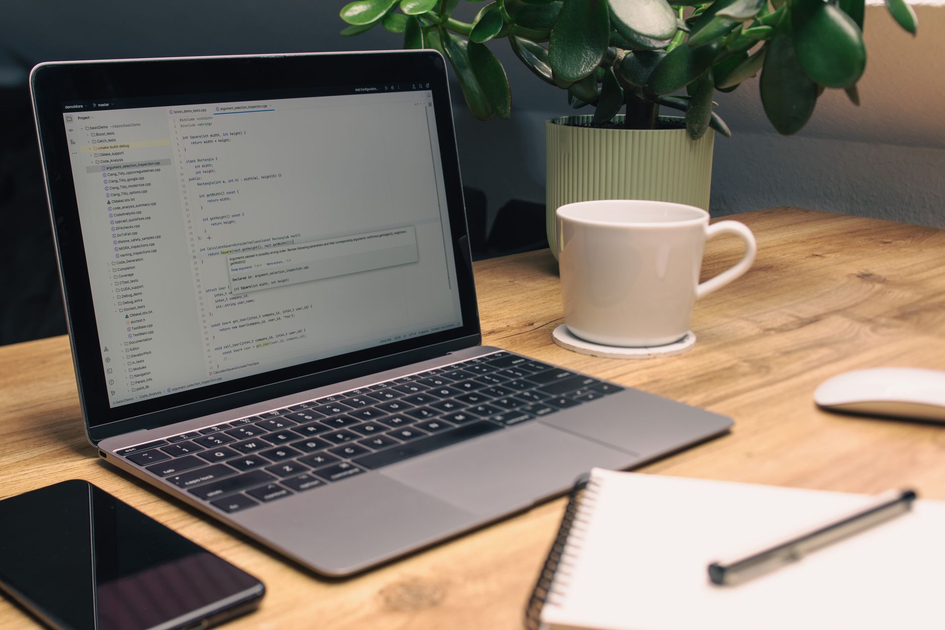modern clean tech workspace with code on screen